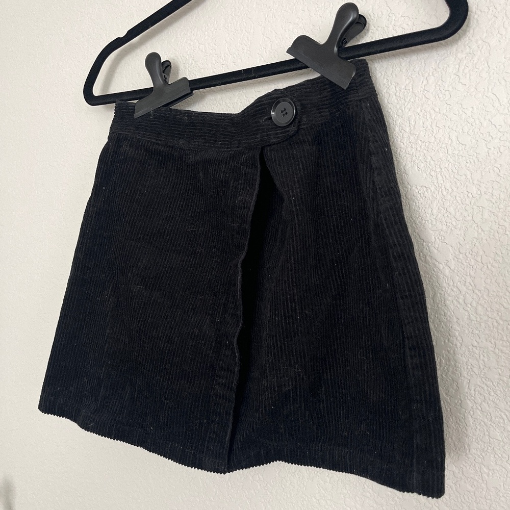 Small black corduroy skirt.